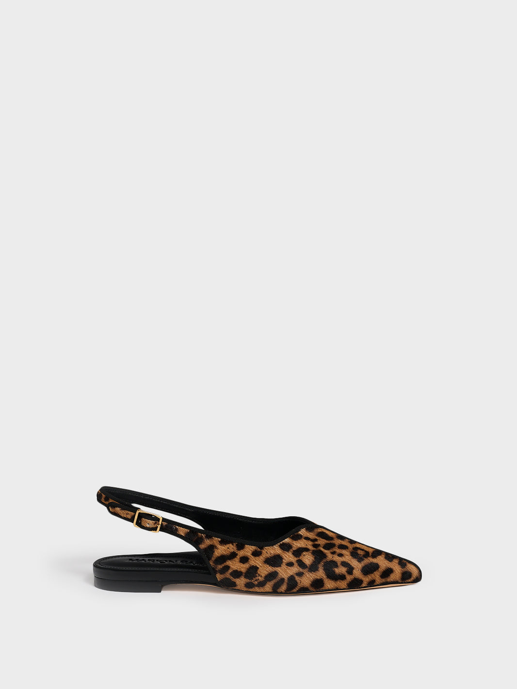 Profile view of a leopard hair calf slingback flat with a grosgrain trim detail.