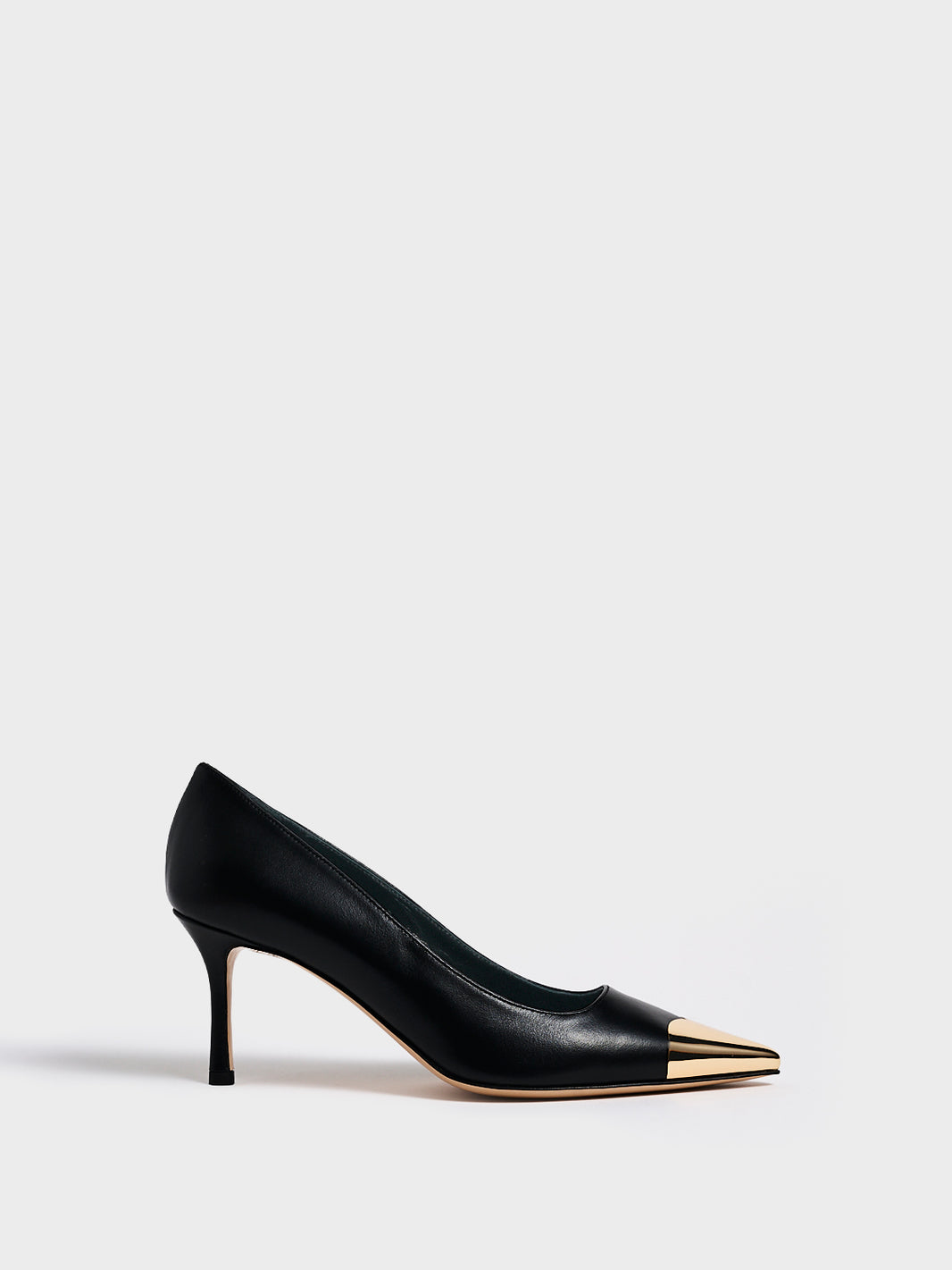 Profile view of a black leather stiletto heel pump with a gold metallic toe cap and a pointed toe.