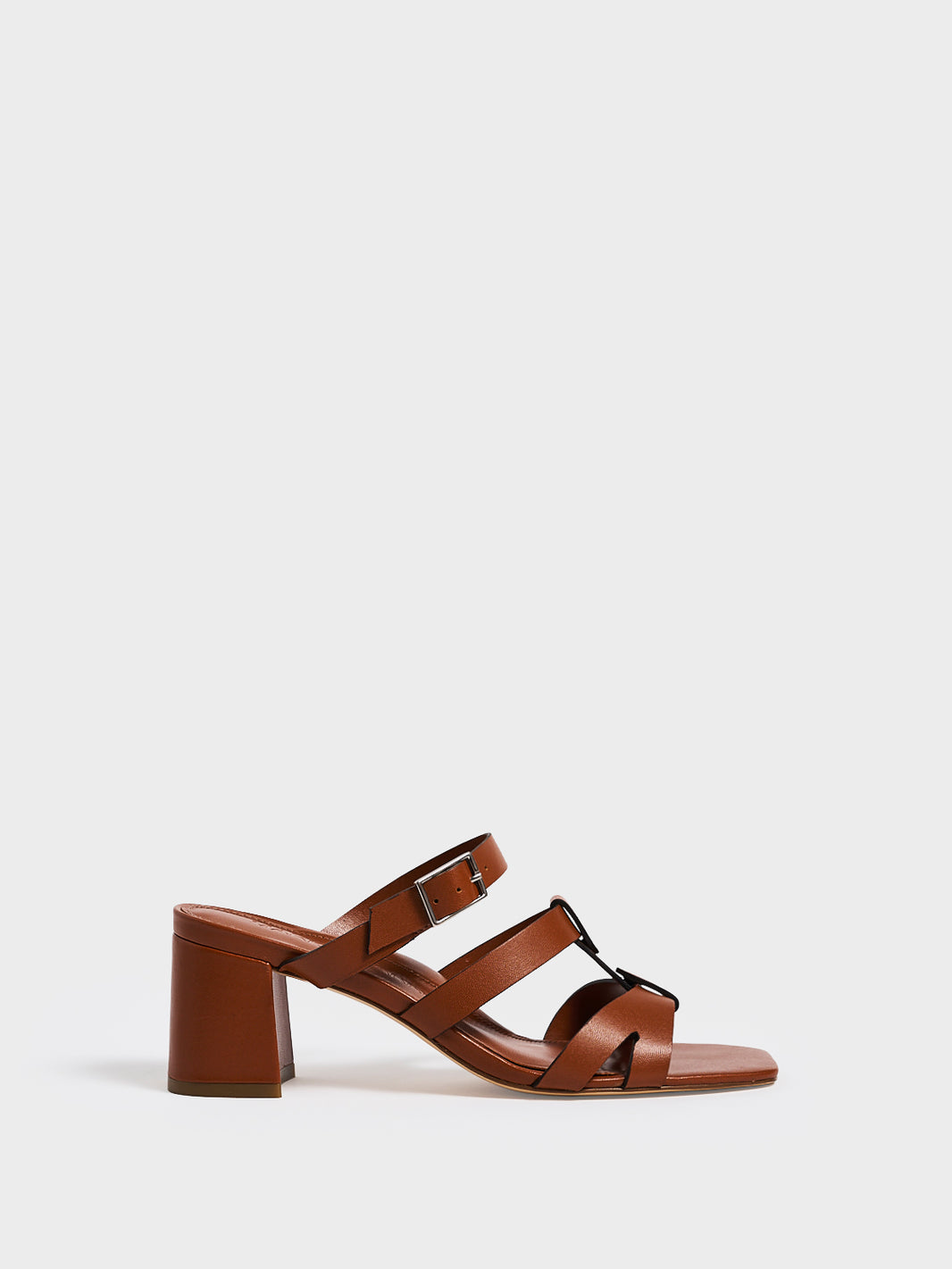 Profile view of an chestnut leather gladiator block heel sandal.