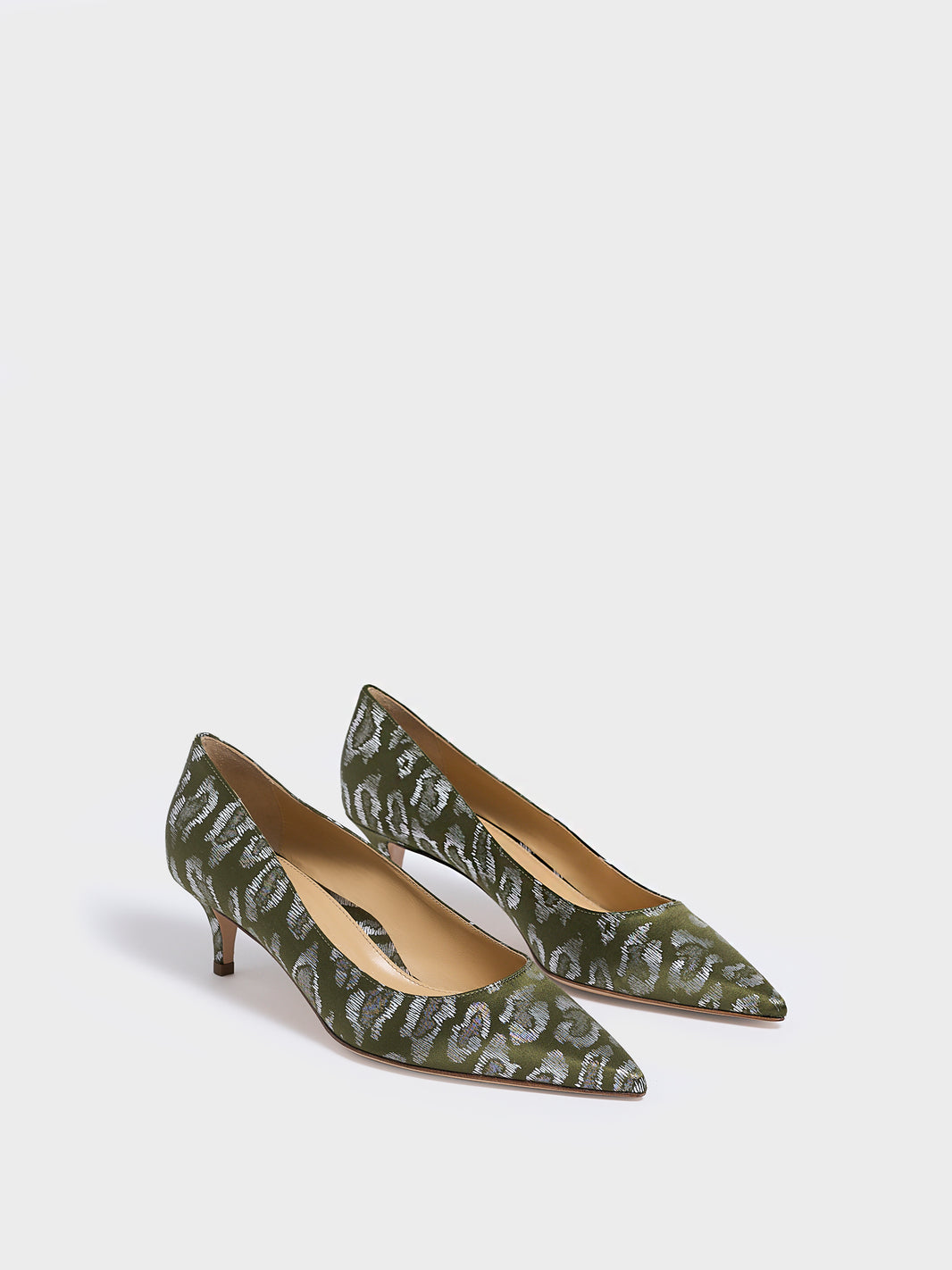 Angle view of a pair of olive green leopard silk kitten stiletto heel pumps with a pointed toe.