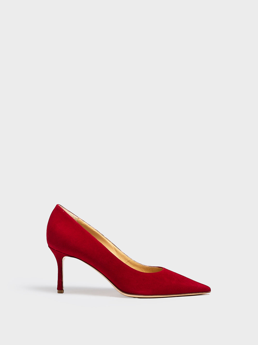 Profile view of a red suede stiletto heel pump with a pointed toe.