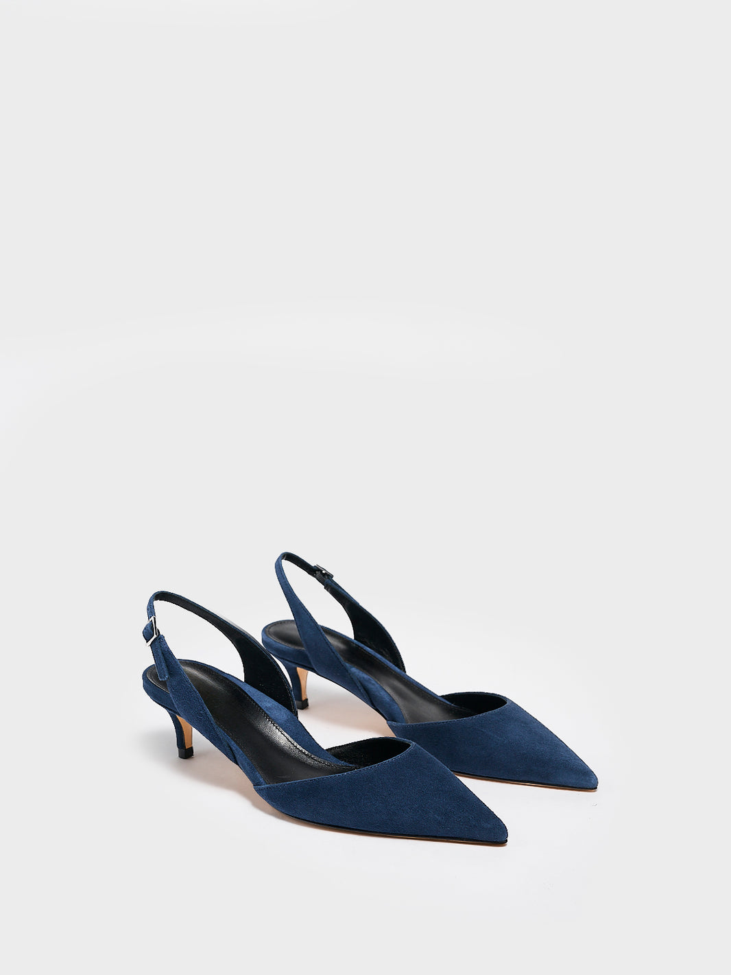 Angle view of a pair of navy suede slingback kitten heels with a pointed toe