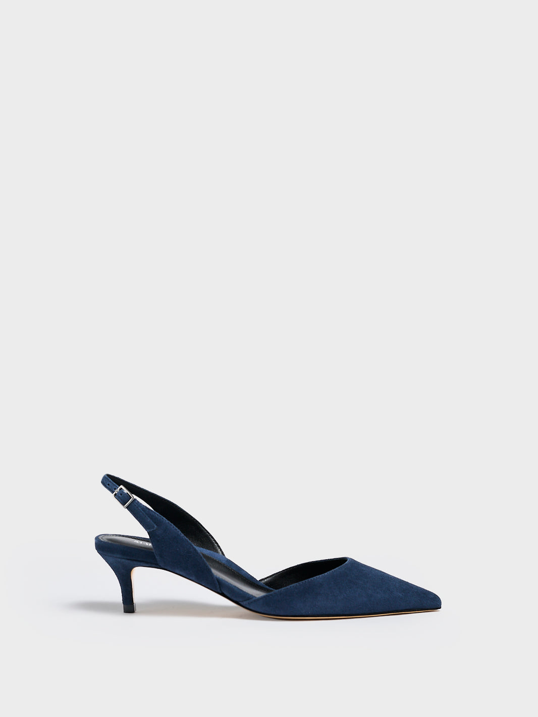 Profile view of a navy blue suede kitten heel slingback with a pointed toe.