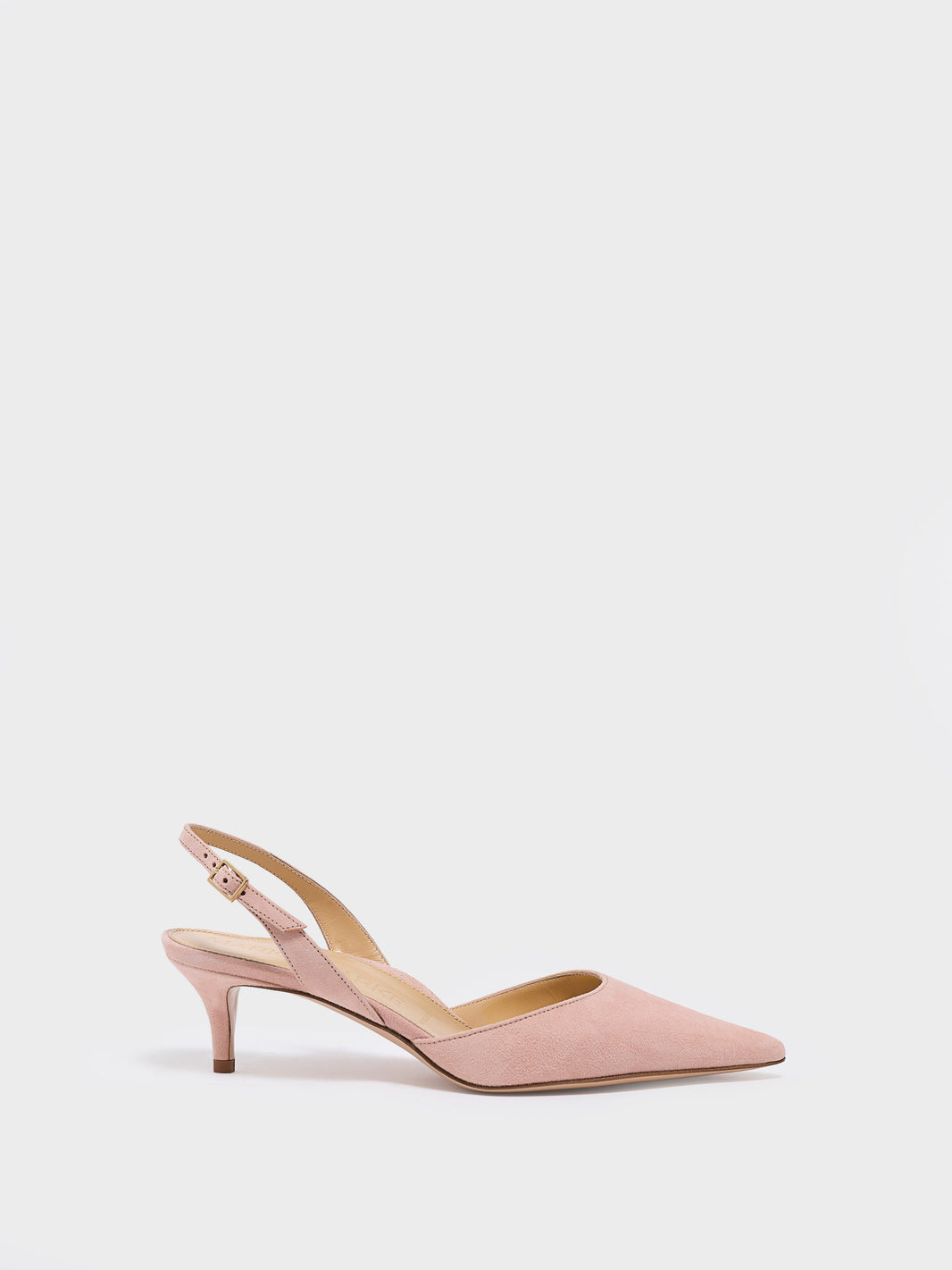 Profile view of a powder suede slingback kitten heel with a pointed toe.