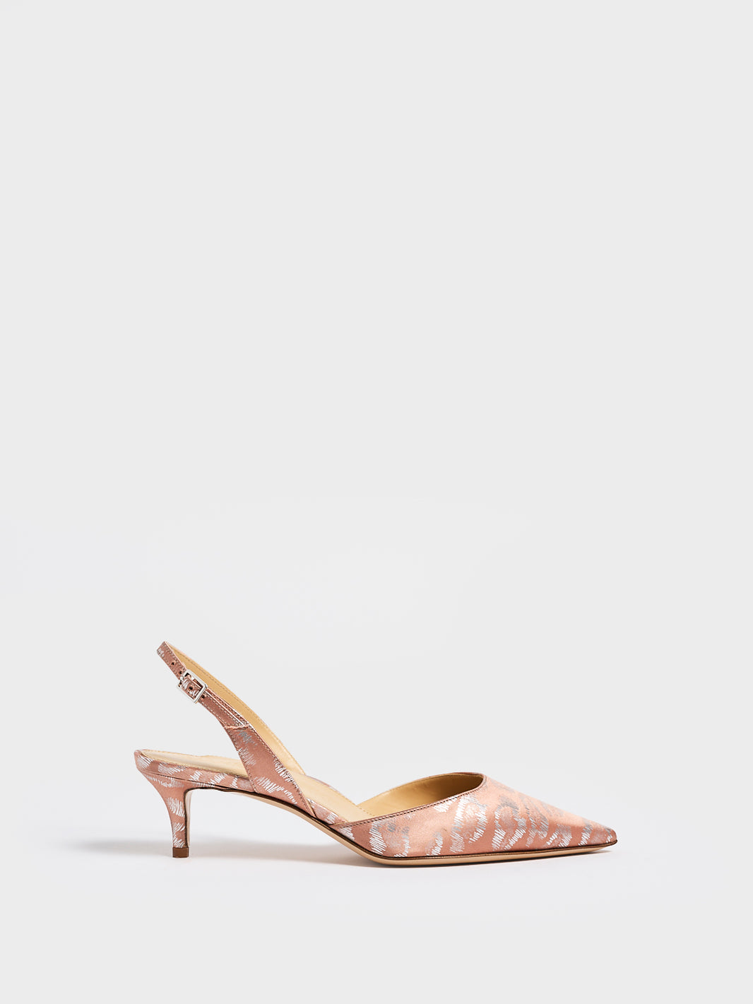 Profile view of a blush leopard silk slingback kitten heel with a pointed toe