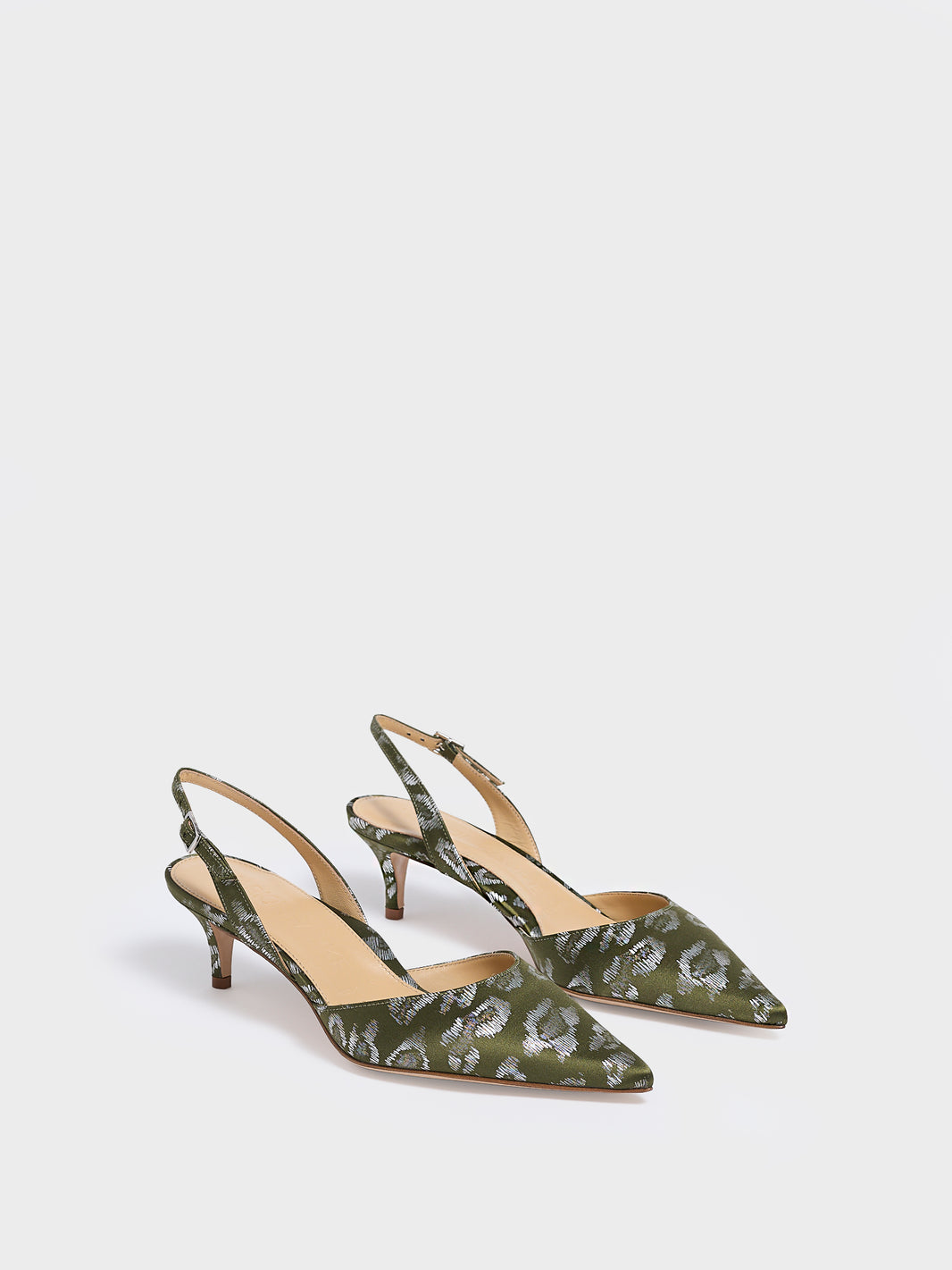 Angle view of a pair of olive green leopard silk slingback kitten heels with a pointed toe.