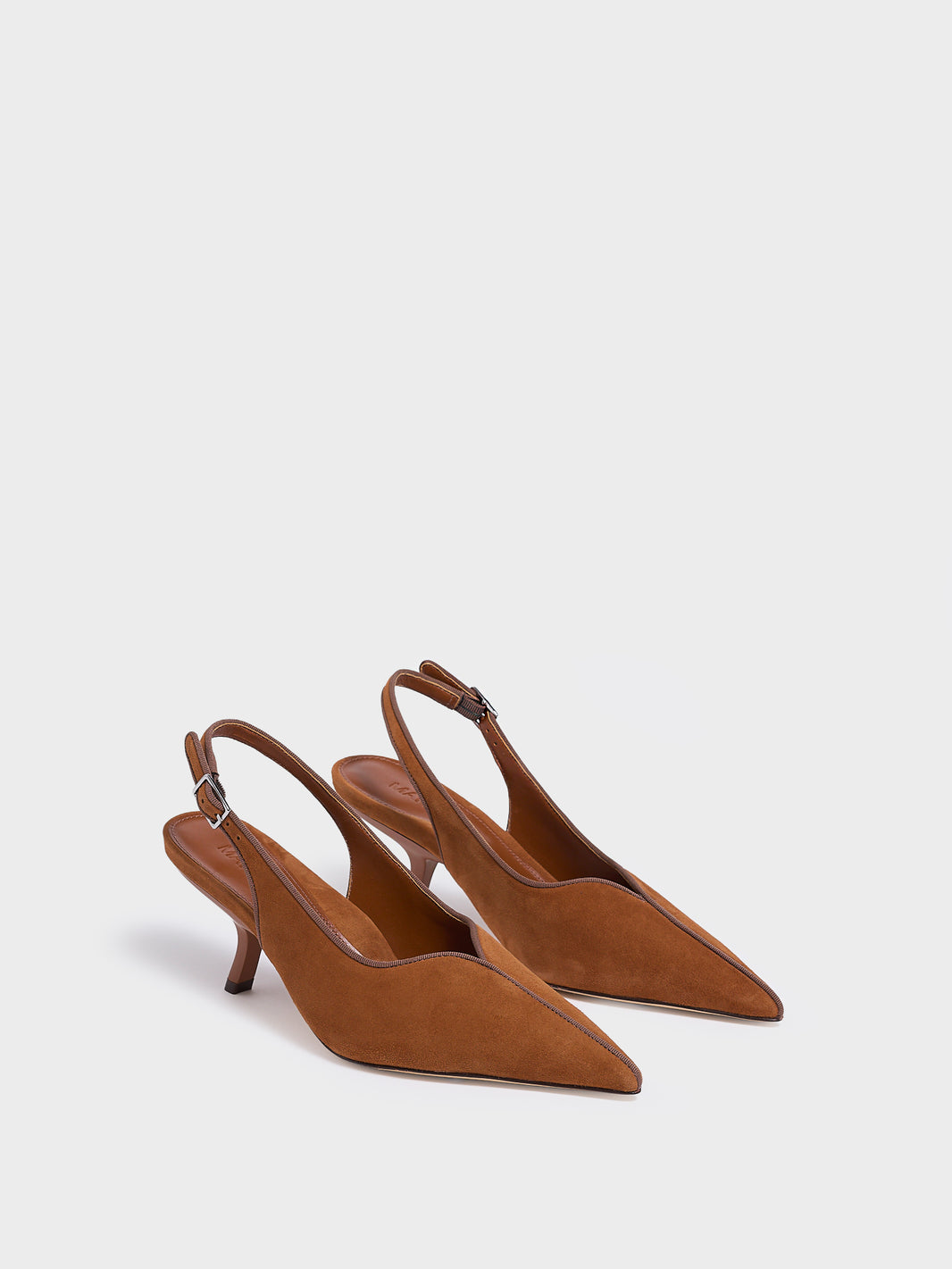 Angle view of a pair of chestnut suede slingback kitten heels with a grosgrain trim and angled heel detail.